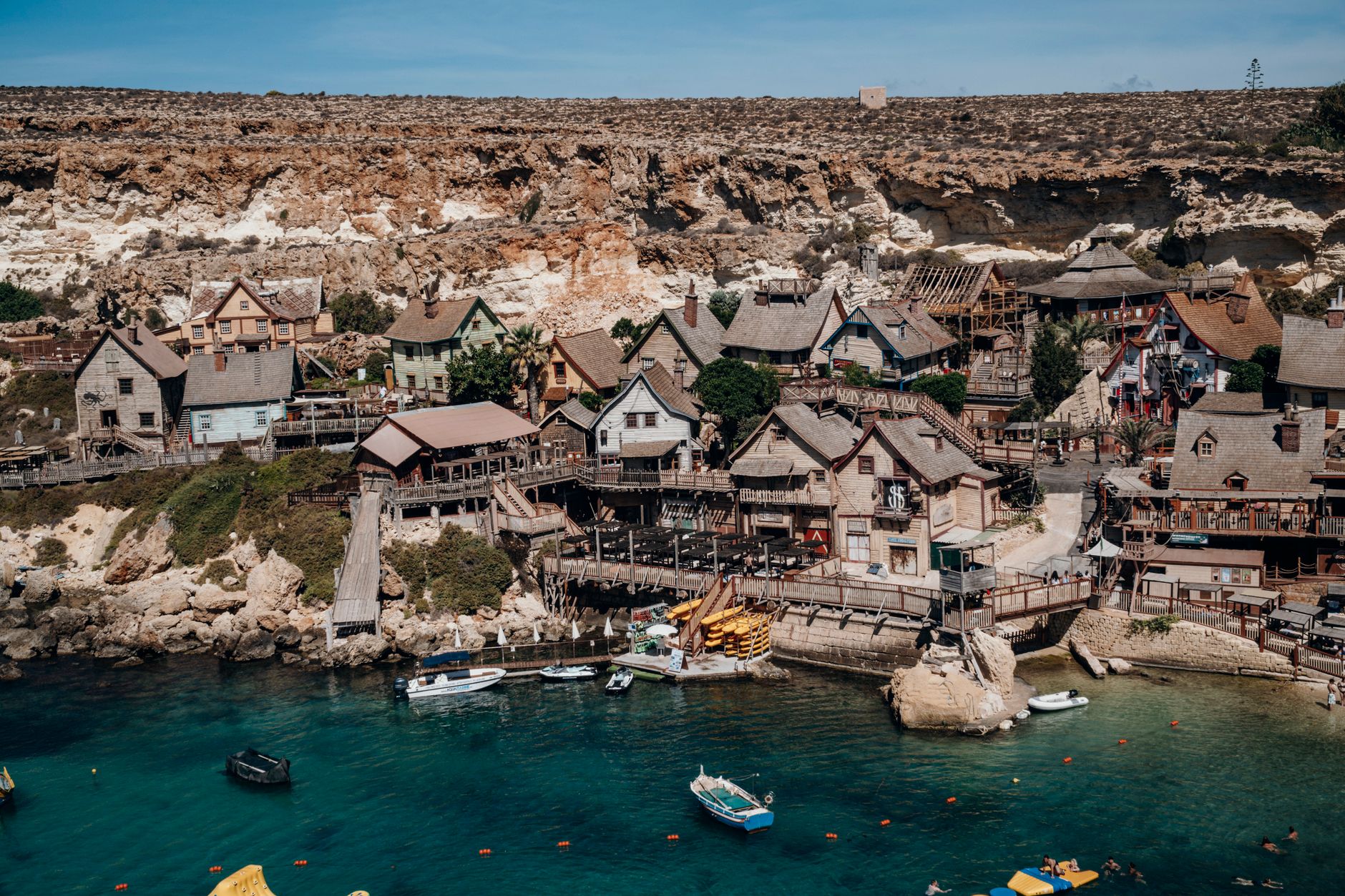 Charming aerial view of Popeye Village's unique architecture by the sea in Malta.