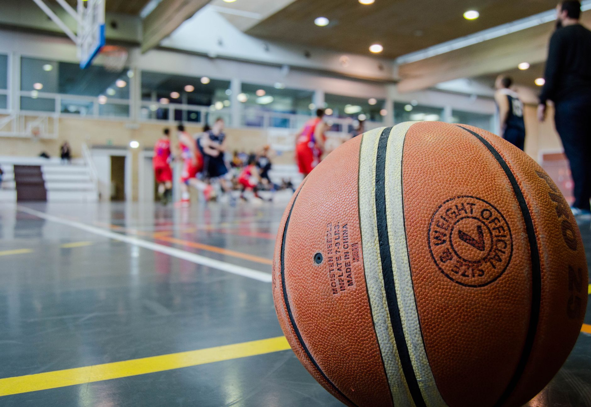 Captivating indoor basketball scene with players actively engaged in a game.