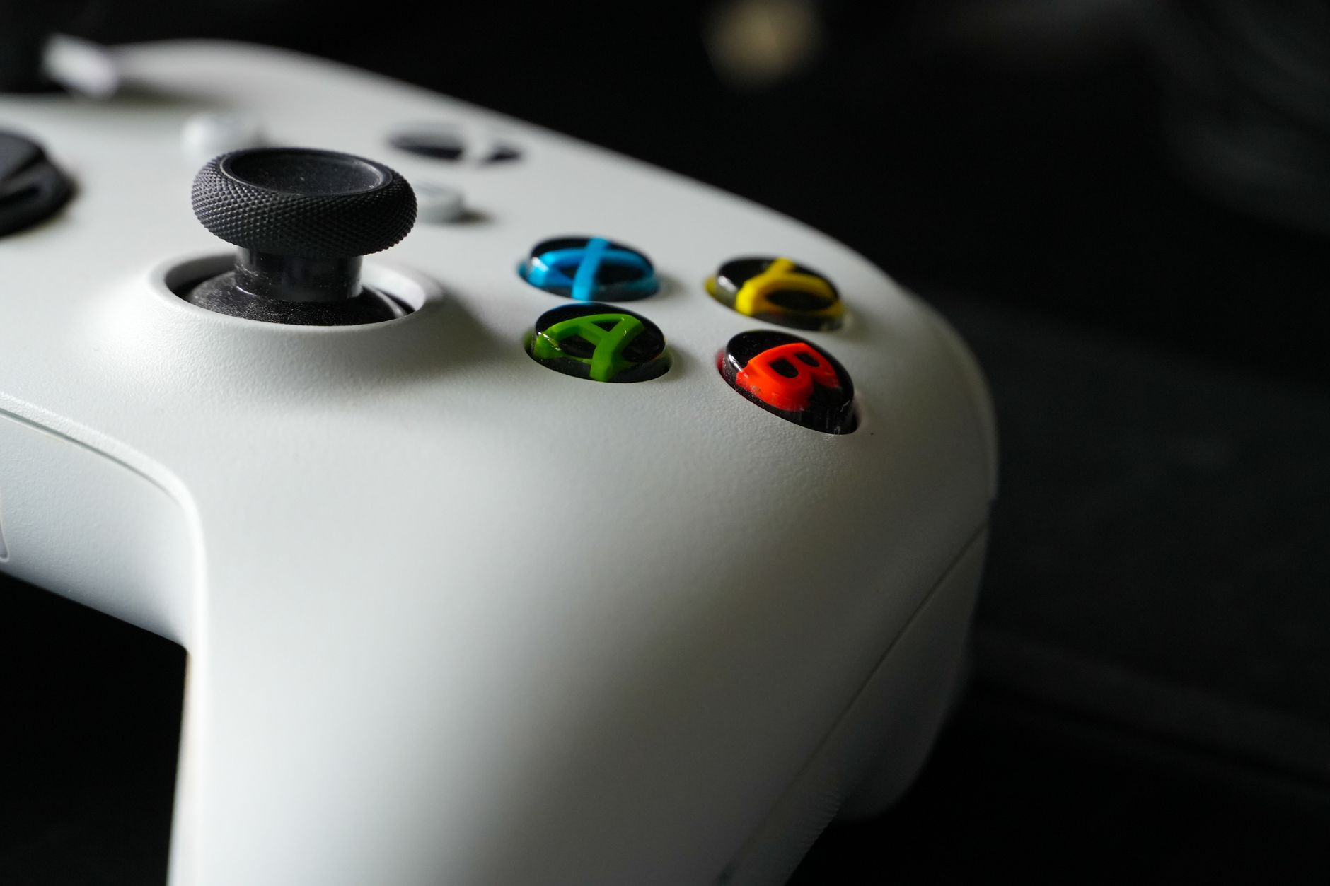 Focus on Xbox controller buttons highlighting gaming technology and design.