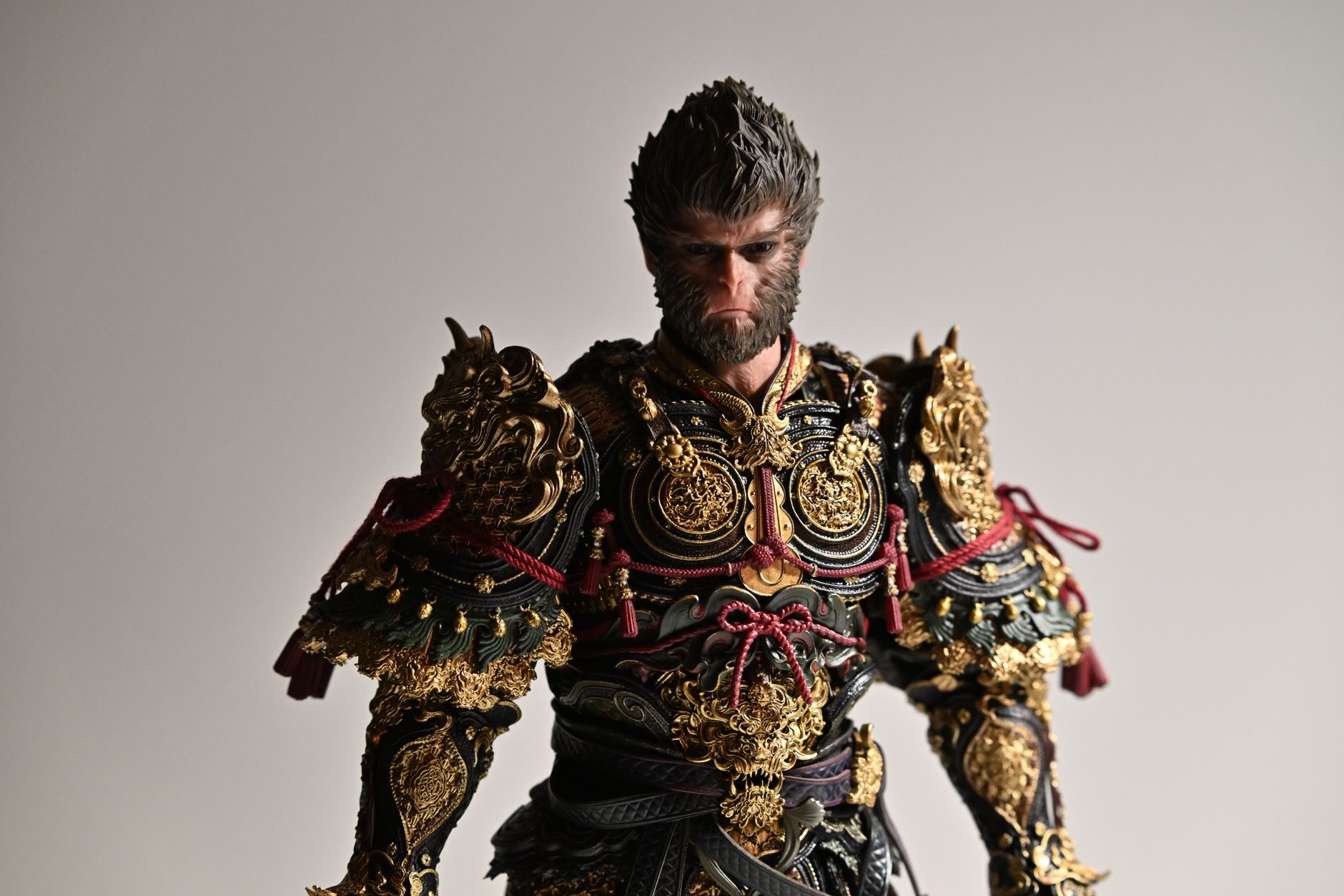 Highly detailed fantasy character in elaborate gold and black armor with mythical elements.